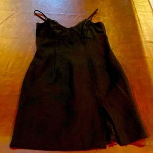 Black cocktail dress with lace detail.